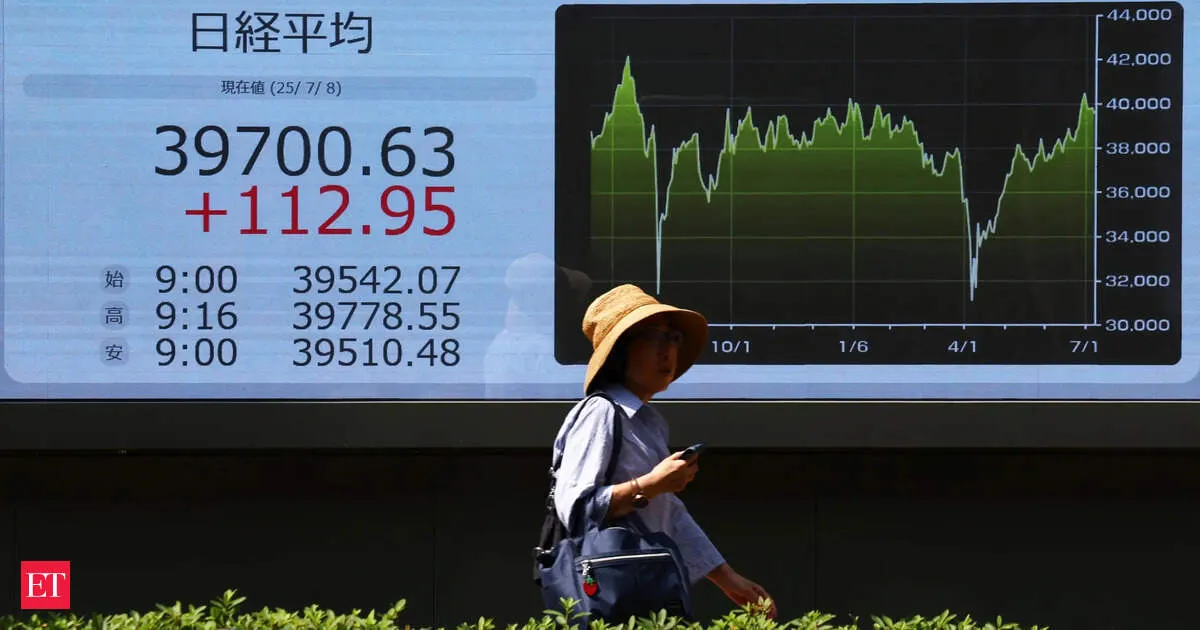 Japan Nikkei hits record high as yen surges on possible Tokyo intervention