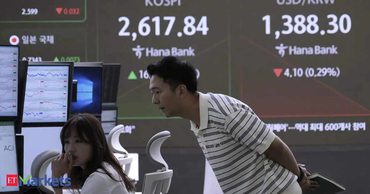 Asian stocks rise as Wall Street hits records on tech optimism and earnings boost