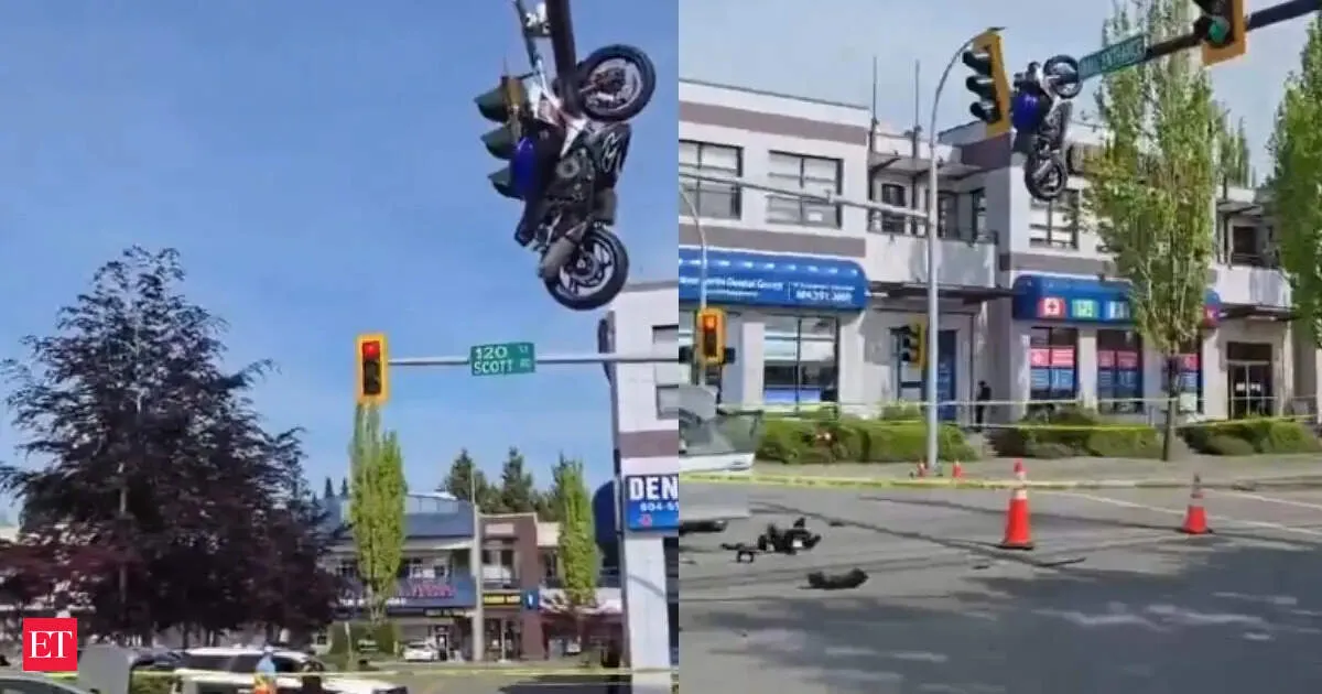Horrific Canada crash motorcycle left dangling from traffic light after one wheel snap