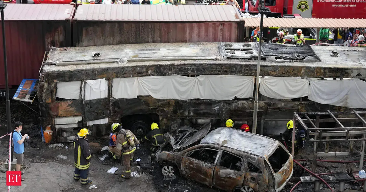Bangkok train crash sparks fire killing eight and injuring 25 as bus and vehicles burn
