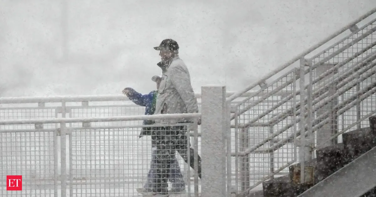 Winter storm slams Colorado and New York as schools close and games postponed