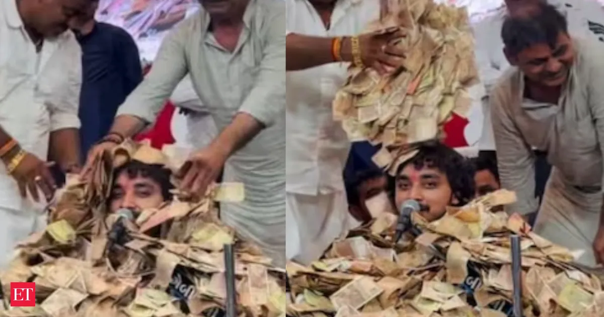 Gujarati folk singer Gopal Sadhu keeps performing as devotees bury him in cash at Dayro