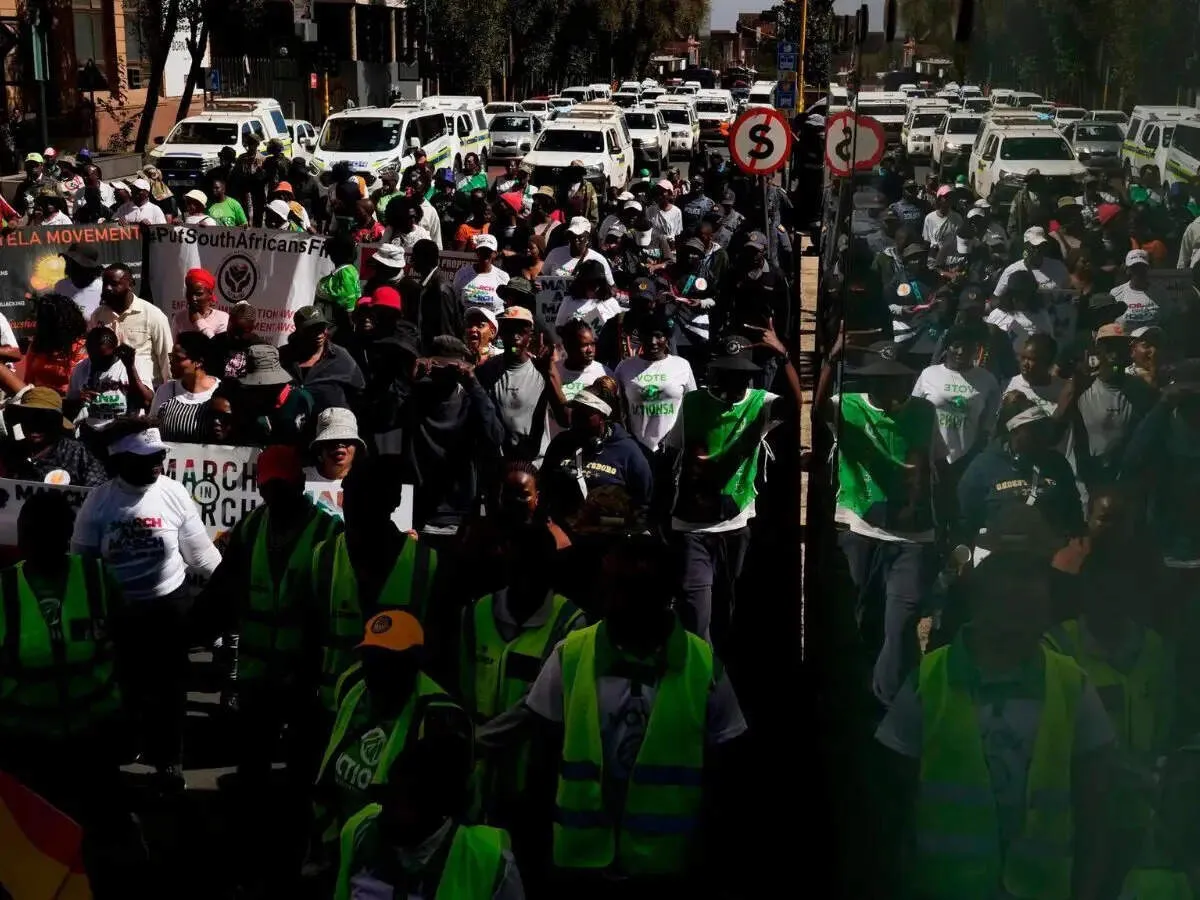 Johannesburg protesters demand mass deportations as shops shut over looting fears
