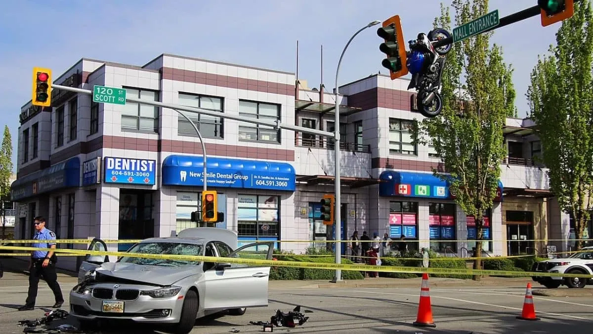 Suzuki sportbike hangs nearly 20 feet above road after crash with BMW in Canada